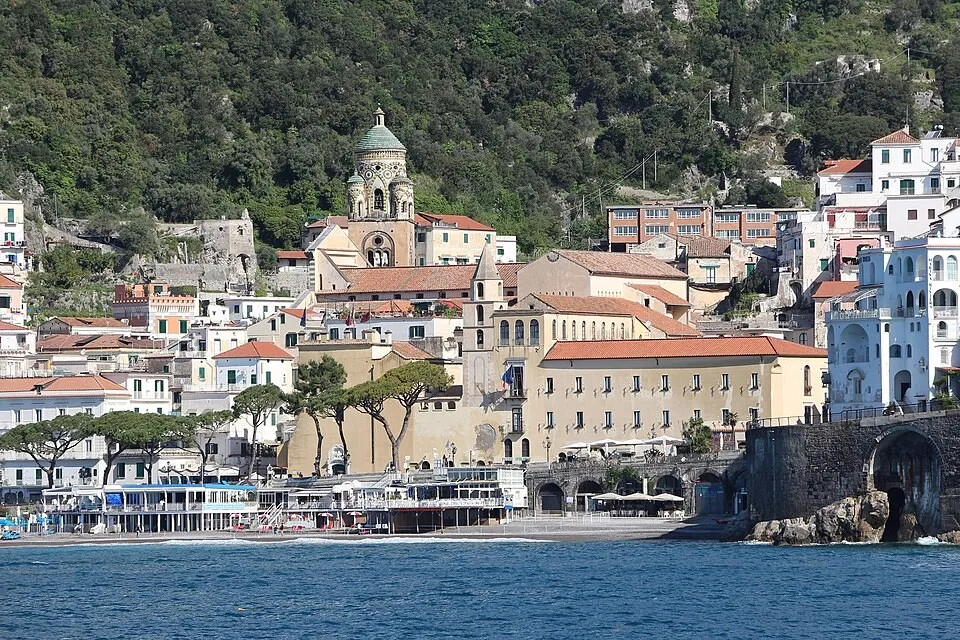 Amalfi Coast - where pastel houses cascade down volcanic cliffs to the sea